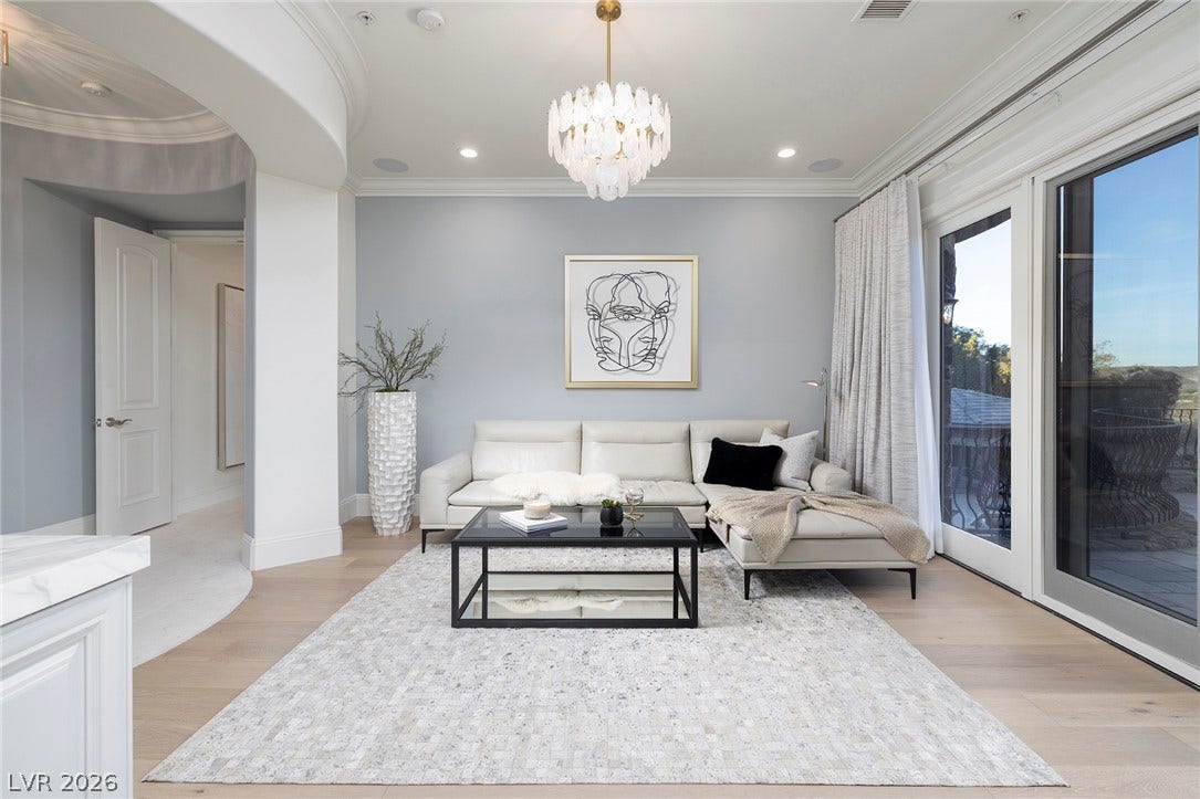 4 Ayden Drive, Henderson, NV 89052 Gleaming wood floors and a custom tray ceiling define this refined living space.
