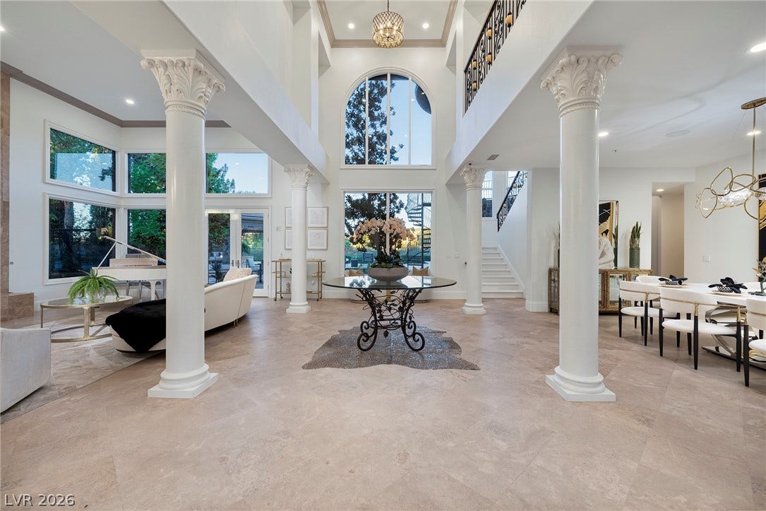 4 Ayden Drive, Henderson, NV 89052 Stately Corinthian columns flank a grand two-story entry featuring polished tile floors.