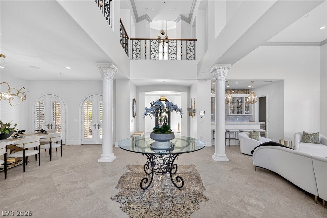 4 Ayden Drive, Henderson, NV 89052 Dramatic columns and soaring ceilings define this grand multi-level entryway.