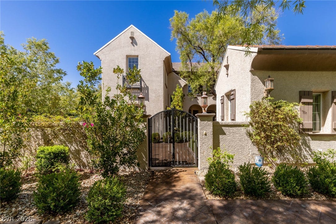 1201 Mersault Court, Las Vegas, NV 89144 An elegant gated entry leads into a private courtyard.