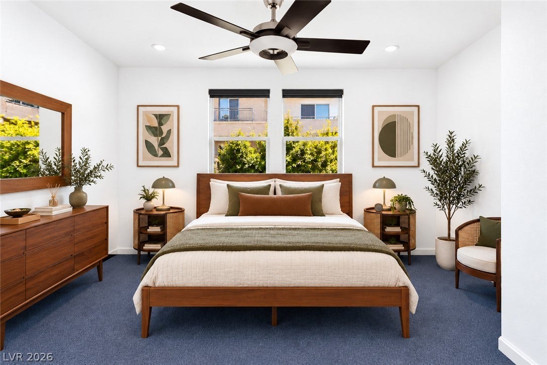 1201 Mersault Court, Las Vegas, NV 89144 Clean lines and double windows define this tranquil bedroom space.