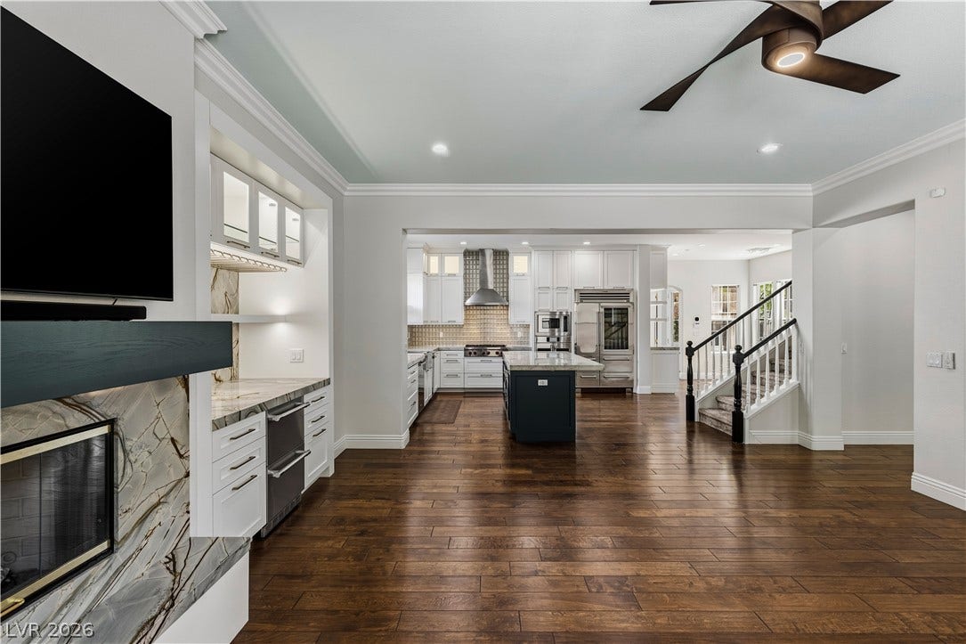 1201 Mersault Court, Las Vegas, NV 89144 Gleaming hardwood floors and classic crown moldings enhance this open-concept main living space.