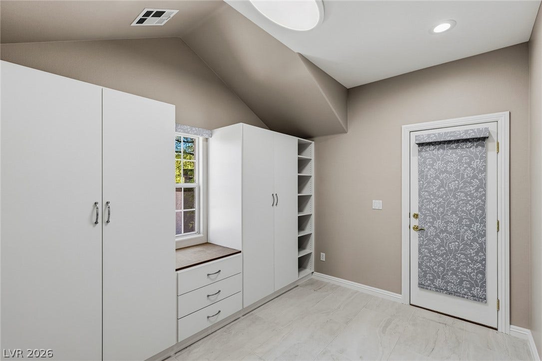 1201 Mersault Court, Las Vegas, NV 89144 Vaulted ceilings and modern built-in cabinetry anchor this versatile storage area.