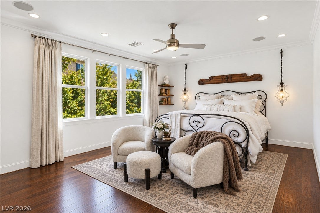 1201 Mersault Court, Las Vegas, NV 89144 Gleaming hardwood floors and classic crown molding define this elegant bedroom.