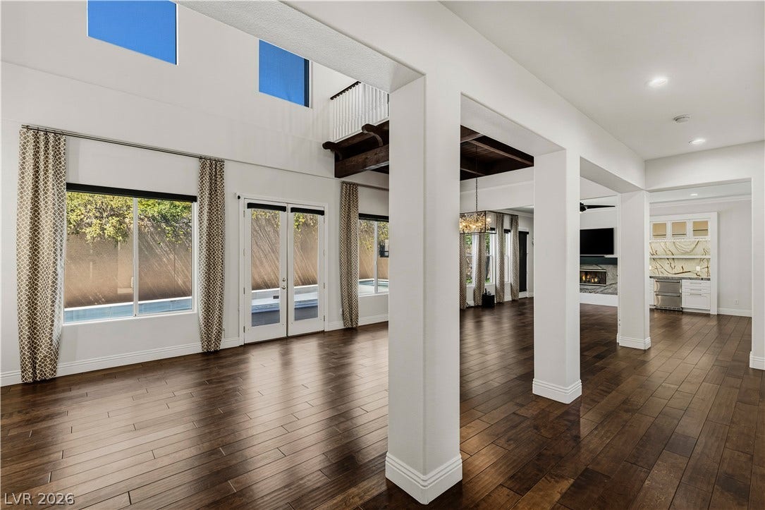 1201 Mersault Court, Las Vegas, NV 89144 Gleaming hardwood floors and a spacious open layout define this airy, light-filled interior.