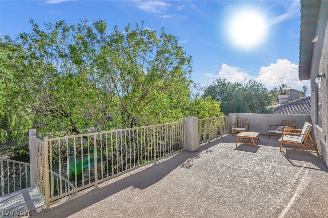 17 Winding Road, Henderson, NV 89052 A spacious elevated balcony provides views of mature trees and the surrounding neighborhood.
