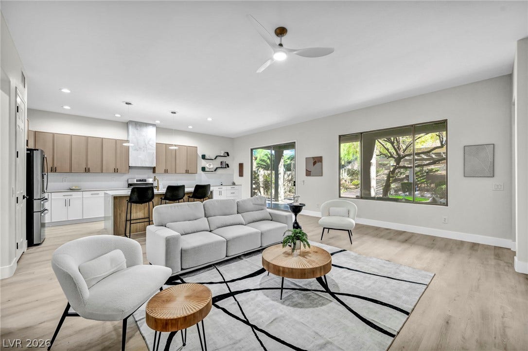 17 Winding Road, Henderson, NV 89052 Virtually staged.
An open floorplan seamlessly connects the airy living area to the modern kitchen.