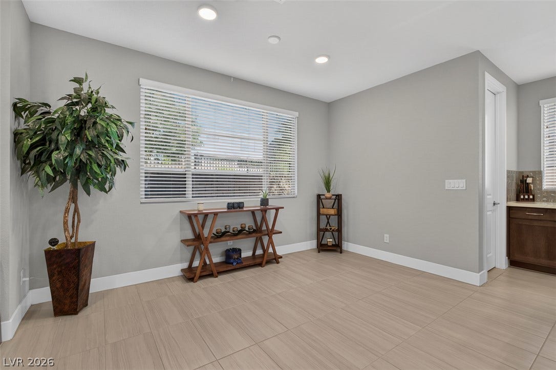 6849 Desert Finch Street, North Las Vegas, NV 89084 Clean tile flooring and abundant natural light create a welcoming dining area.