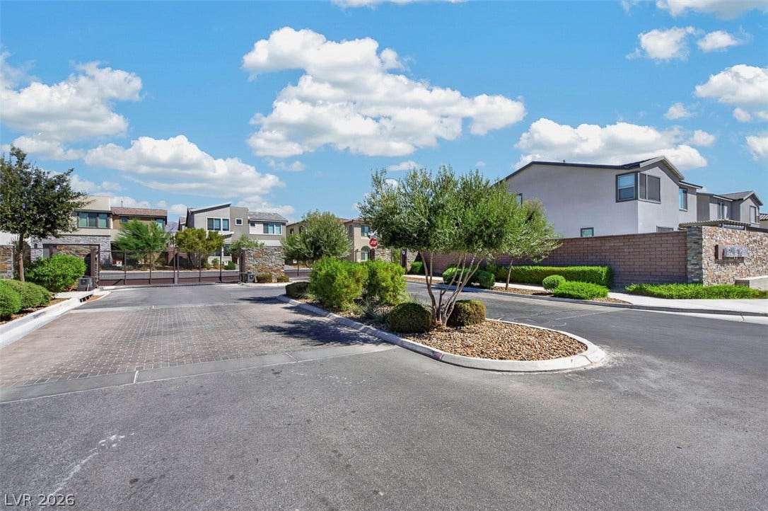 6849 Desert Finch Street, North Las Vegas, NV 89084 Manicured landscaping accents the welcoming gated entrance to this modern residential community.
