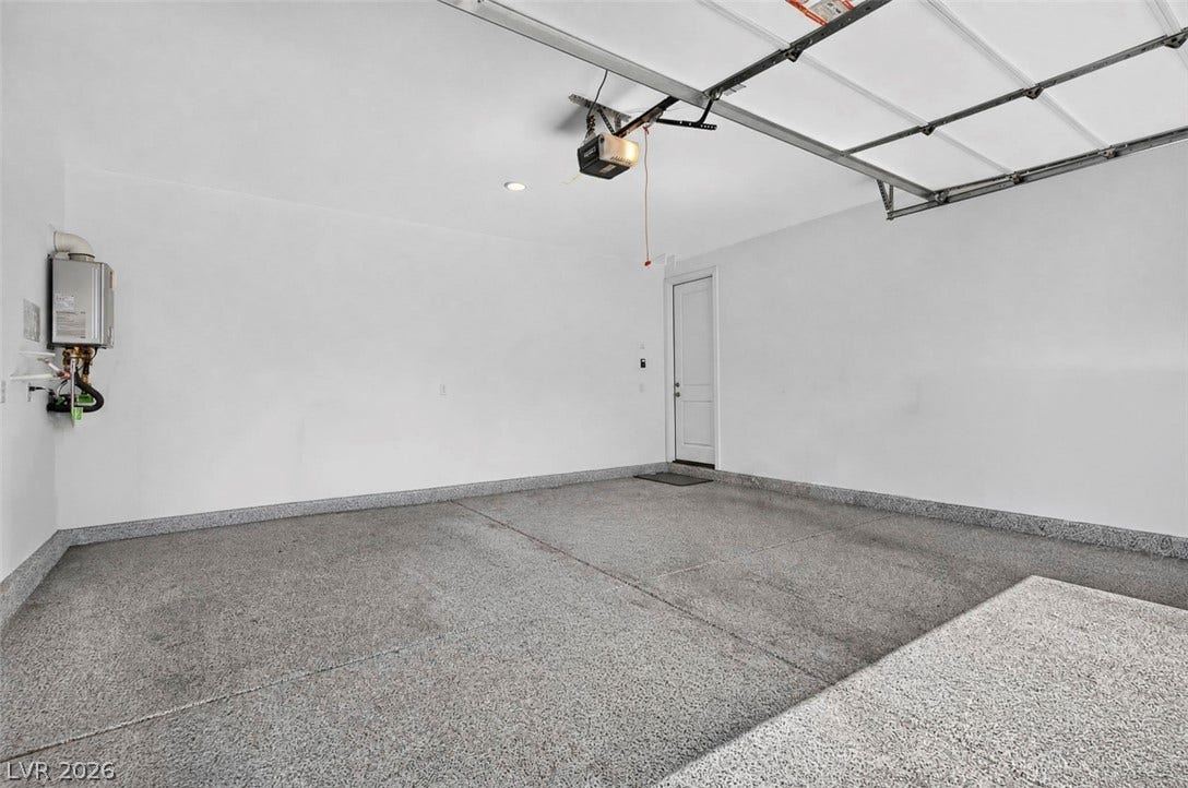 6849 Desert Finch Street, North Las Vegas, NV 89084 2-car garage with epoxy flooring. An immaculate garage features durable epoxy flooring and clean finished walls.