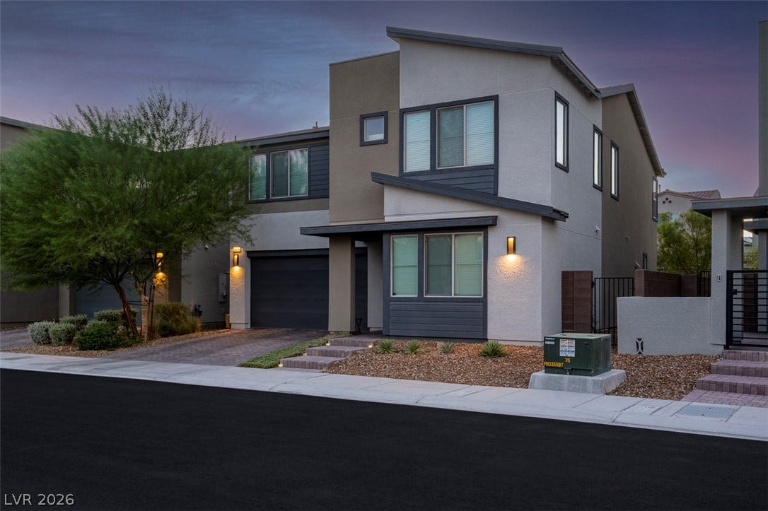6849 Desert Finch Street, North Las Vegas, NV 89084 Clean lines and multi-textured facades define this contemporary multi-level home under a twilight sky.