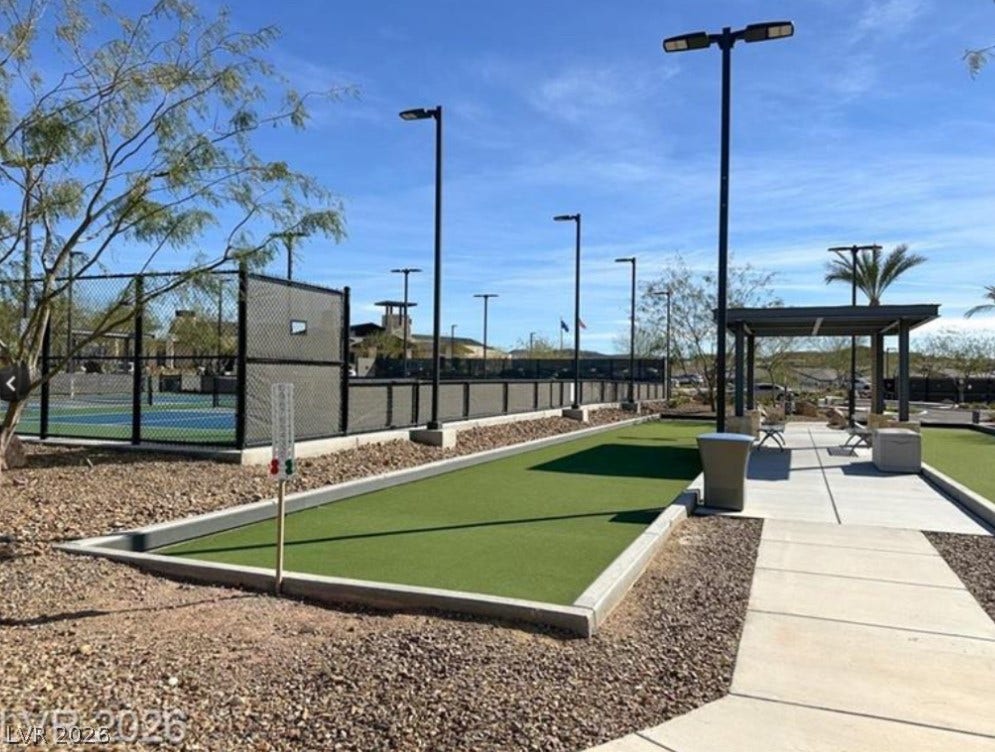 162 Palm Fox Court, Henderson, NV 89011 Outdoor recreation area features a bocce ball court and adjacent tennis courts under sunny skies.