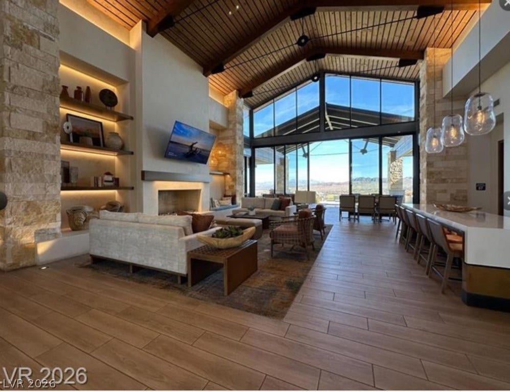 162 Palm Fox Court, Henderson, NV 89011 Soaring vaulted wood ceilings and massive glass walls frame breathtaking desert views.