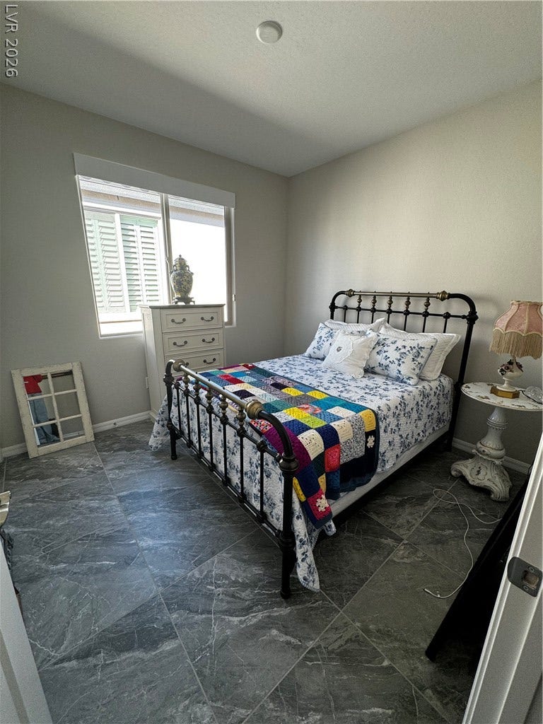 162 Palm Fox Court, Henderson, NV 89011 Stone tile flooring and a large window enhance this quiet, comfortable retreat.