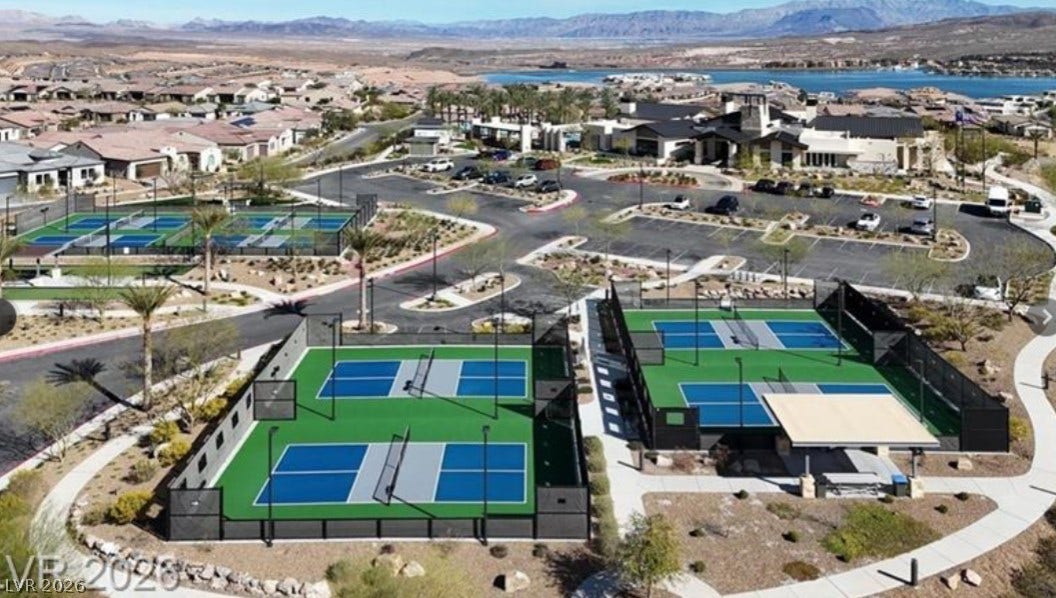 162 Palm Fox Court, Henderson, NV 89011 State-of-the-art sports courts sit within a master-planned community near glistening waters and distant mountains.