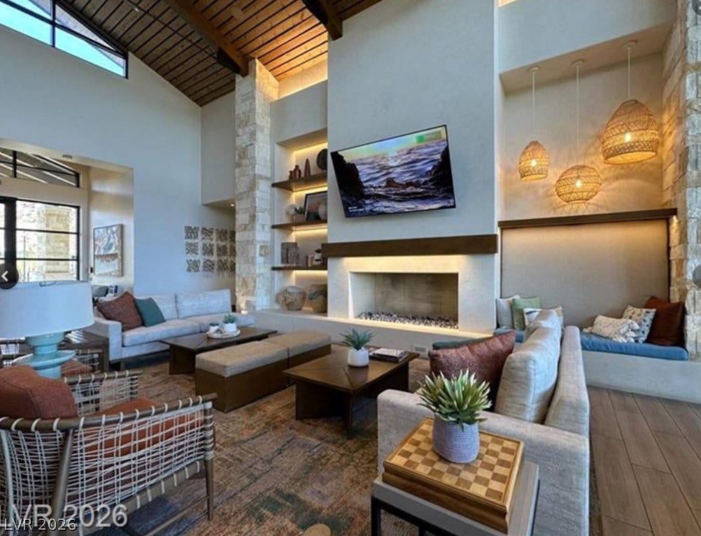 162 Palm Fox Court, Henderson, NV 89011 Soaring wood-plank ceilings and a massive stone fireplace anchor this grand living space.