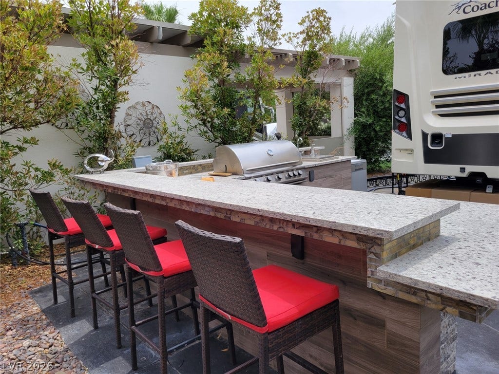 8175 Arville Street, #293, Las Vegas, NV 89139 A stone counter crowns the outdoor kitchen, perfect for entertaining.
