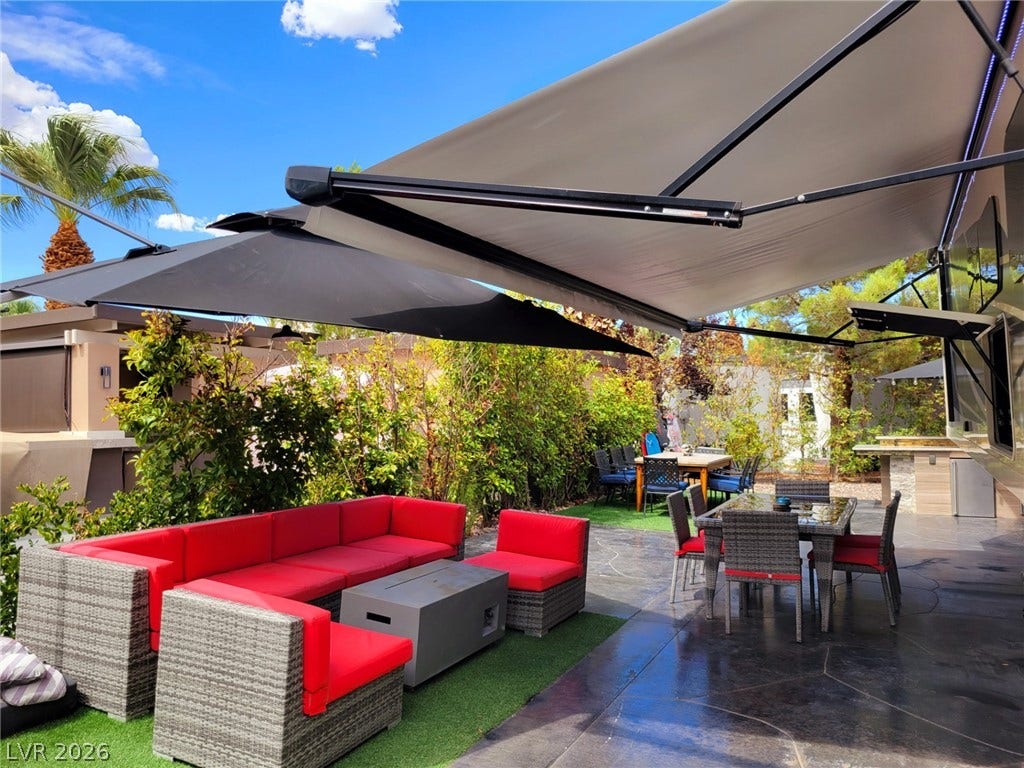 8175 Arville Street, #293, Las Vegas, NV 89139 A spacious concrete patio area is sheltered by large protective awnings.