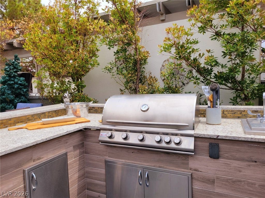 8175 Arville Street, #293, Las Vegas, NV 89139 An outdoor kitchen features durable stone countertops and a premium built-in grill.