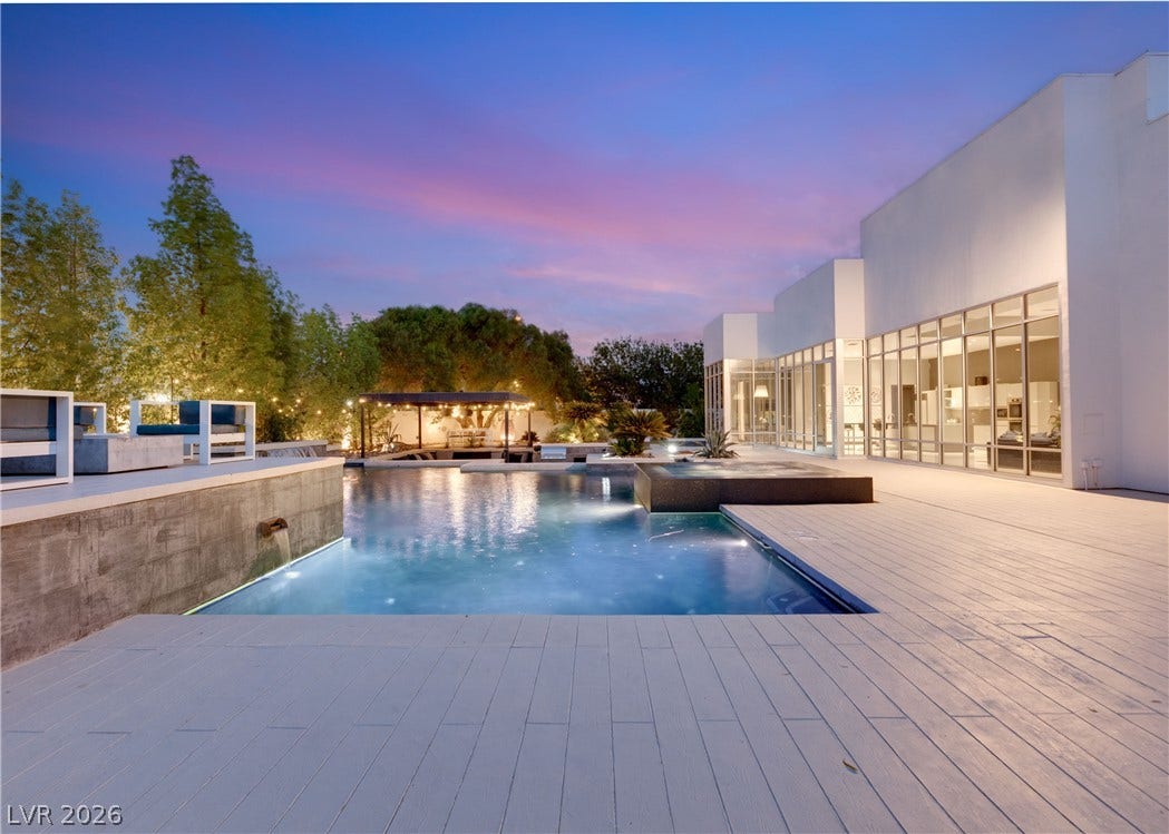 3716 Caesars Circle, Las Vegas, NV 89120 Architectural modernism meets resort-style living with an expansive terrace, pool, and wall of glass.