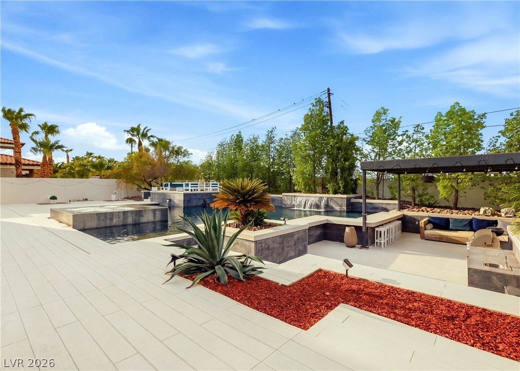 3716 Caesars Circle, Las Vegas, NV 89120 A resort-style swimming pool anchors this backyard oasis featuring a shaded lounge area.