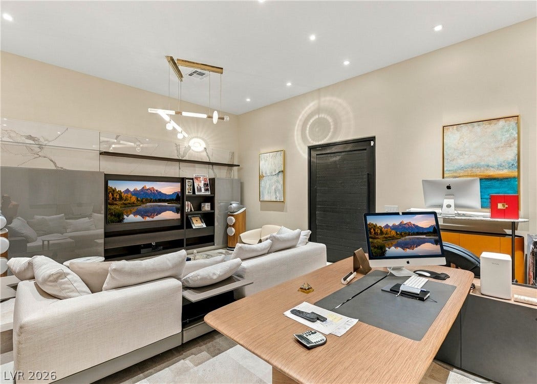 3716 Caesars Circle, Las Vegas, NV 89120 Gleaming tile floors and high ceilings with recessed lighting define this versatile work and leisure space.
