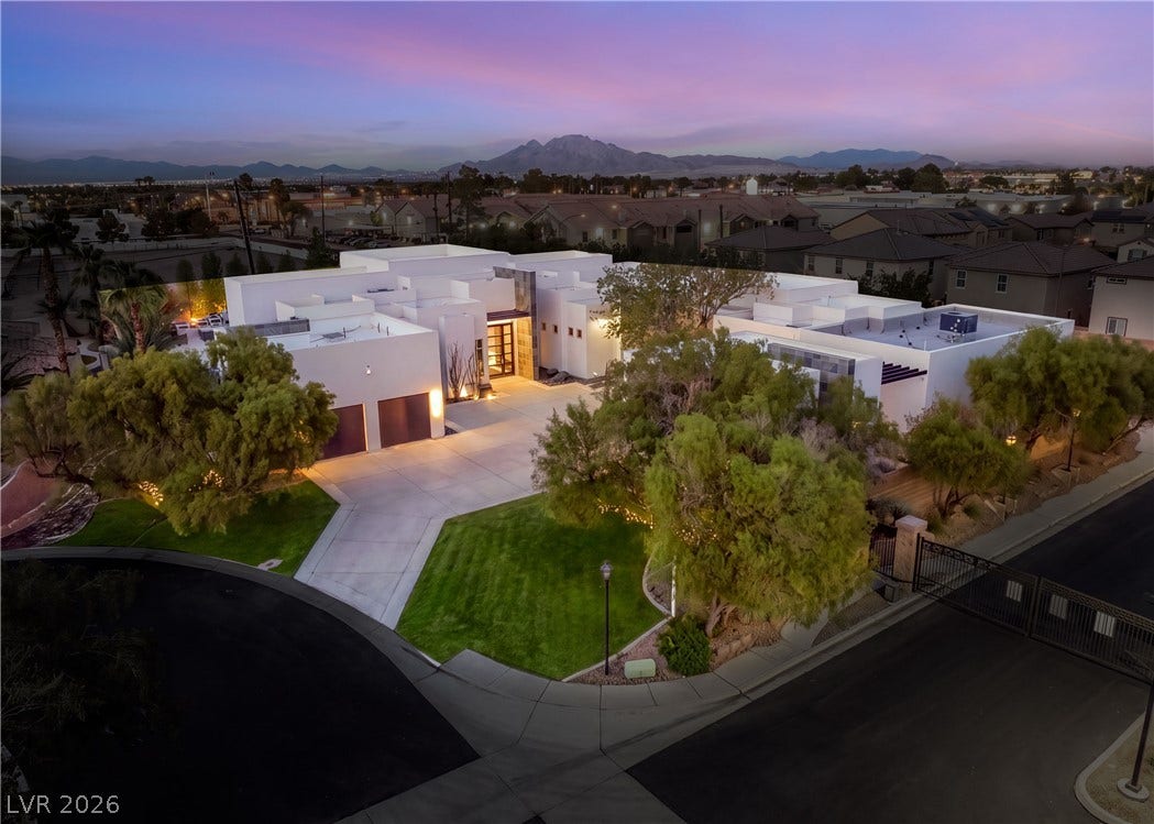 3716 Caesars Circle, Las Vegas, NV 89120 Dramatic mountain views provide a breathtaking backdrop for this modern desert estate.