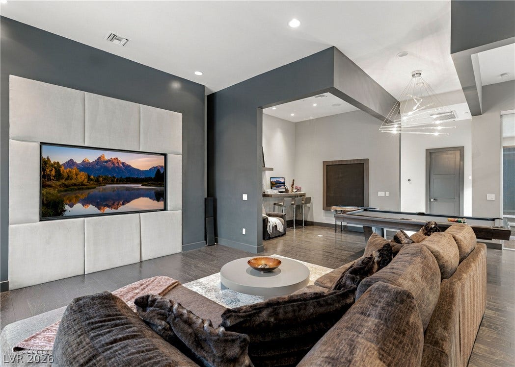 3716 Caesars Circle, Las Vegas, NV 89120 Gleaming hardwood floors and a modern recessed ceiling detail define this open concept living space.