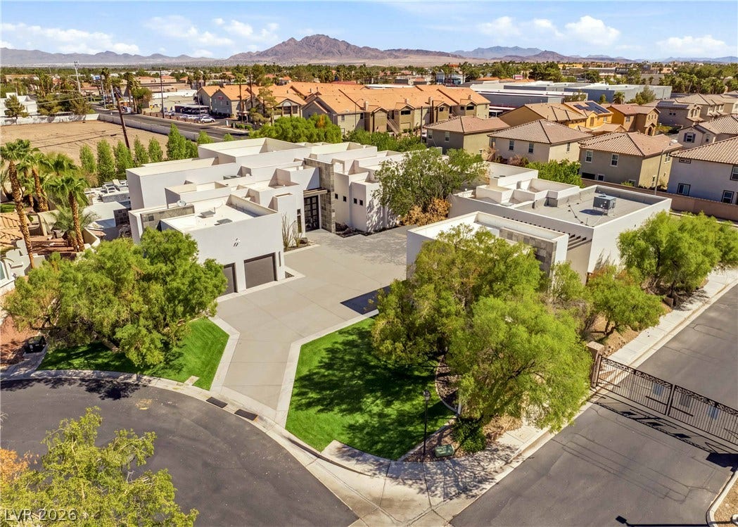3716 Caesars Circle, Las Vegas, NV 89120 Striking contemporary architecture anchors this custom estate with scenic mountain backdrops.