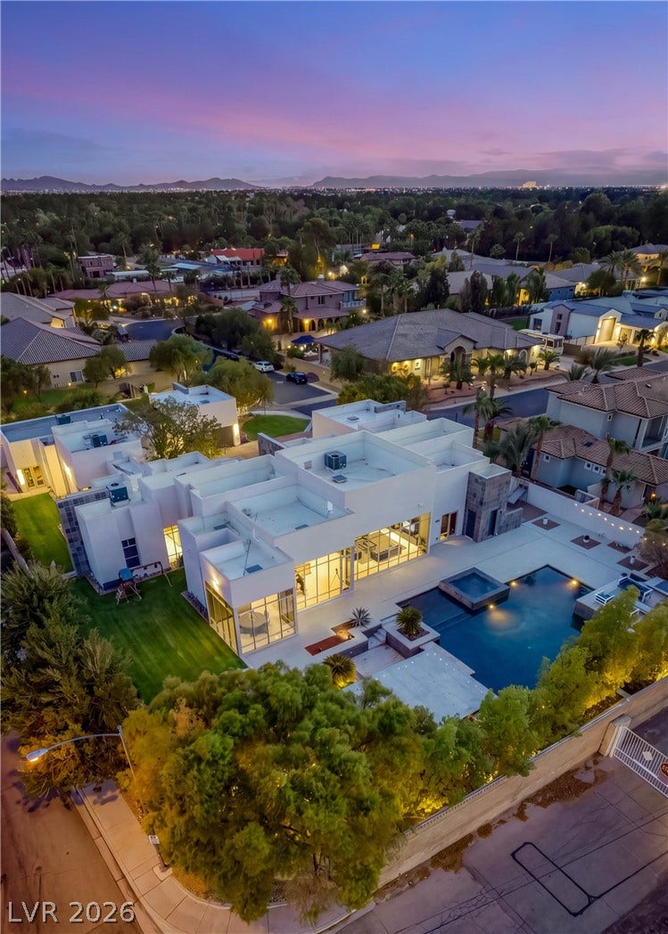 3716 Caesars Circle, Las Vegas, NV 89120 Contemporary architectural lines define this gated estate featuring a backyard pool and mountain views.
