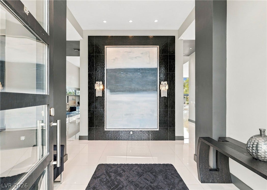 3716 Caesars Circle, Las Vegas, NV 89120 Polished tile flooring and high ceilings establish an immediate sense of grandeur upon entry.