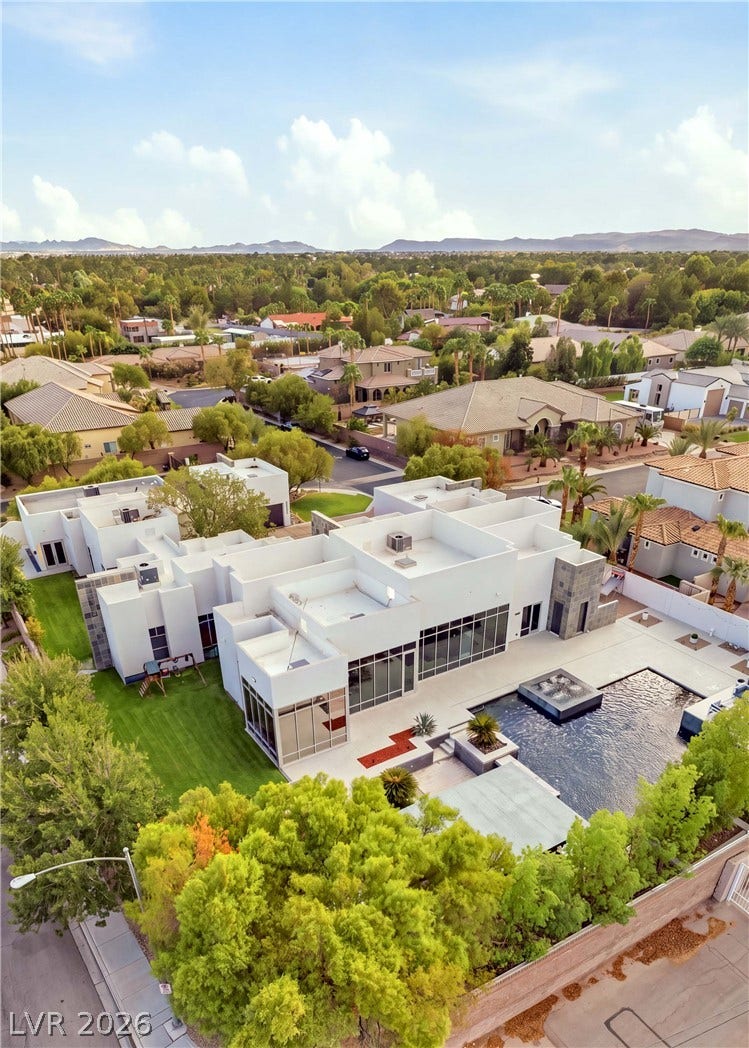 3716 Caesars Circle, Las Vegas, NV 89120 Clean lines and geometric architecture define this modern estate featuring a private pool and manicured lawn.