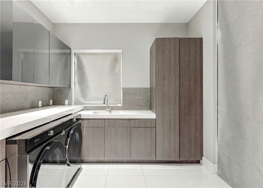 3716 Caesars Circle, Las Vegas, NV 89120 Sleek contemporary cabinetry and pristine tile flooring define this highly functional workspace.