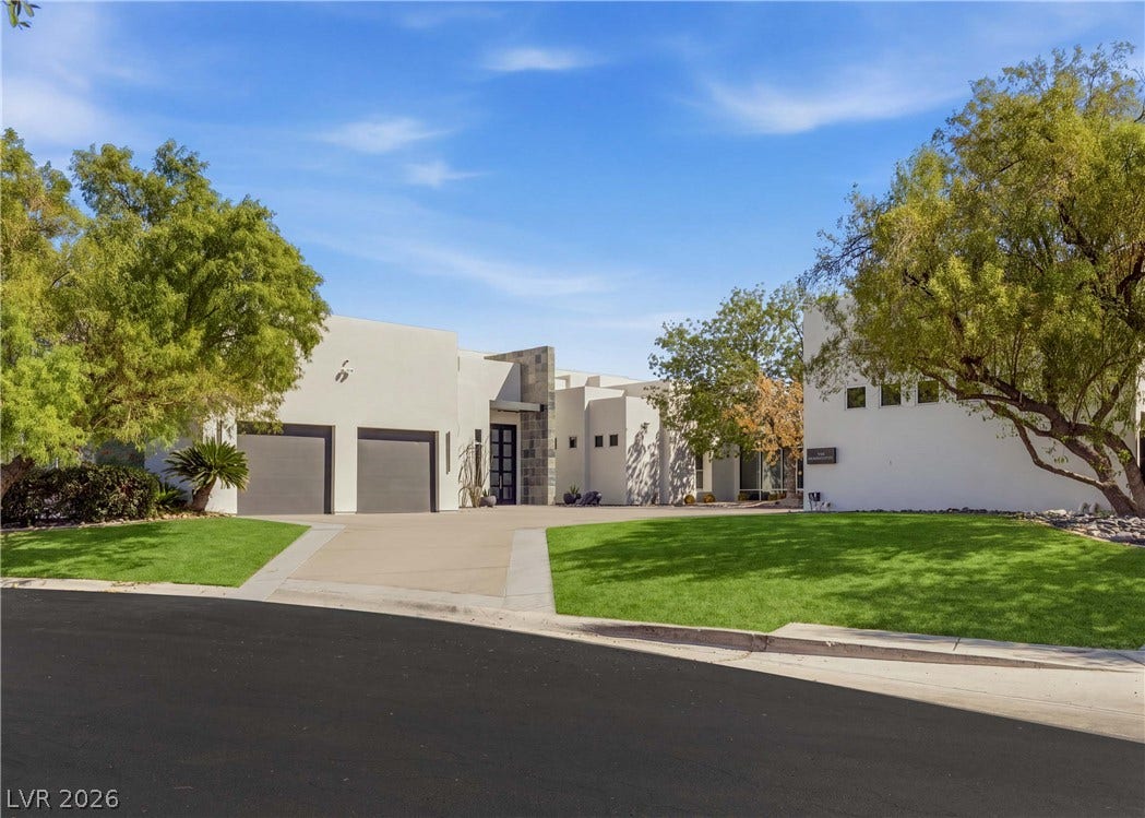 3716 Caesars Circle, Las Vegas, NV 89120 Mature trees frame the clean lines of this modern estate with a spacious front driveway.