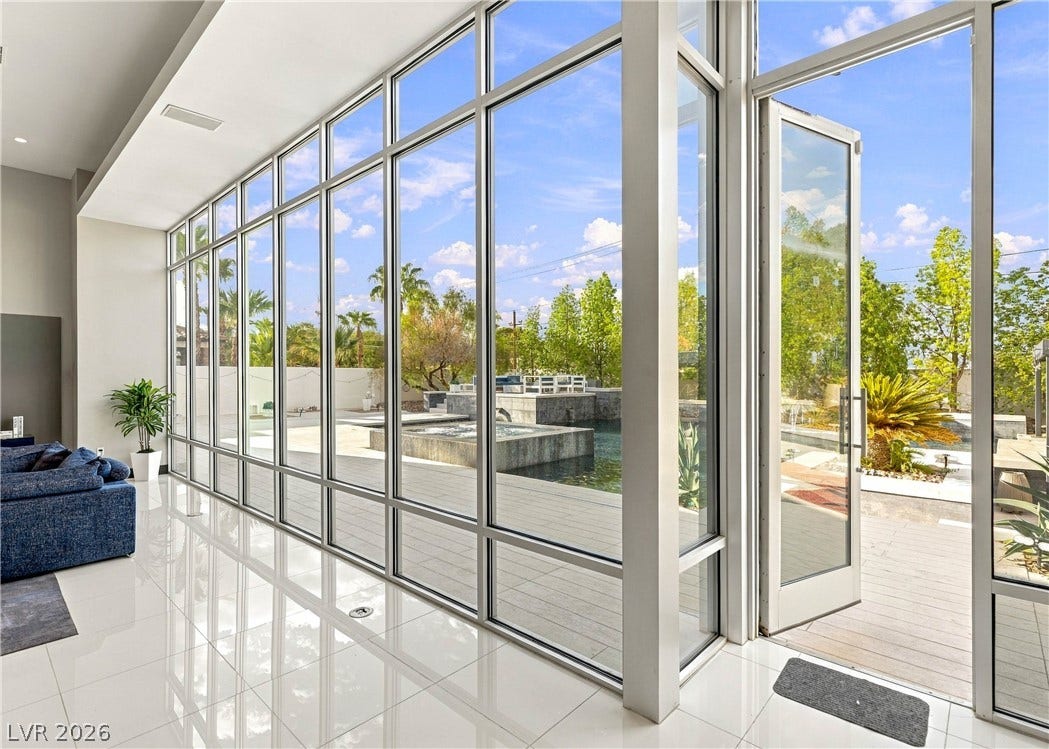 3716 Caesars Circle, Las Vegas, NV 89120 Towering glass walls flood this sleek, polished space with abundant natural light.