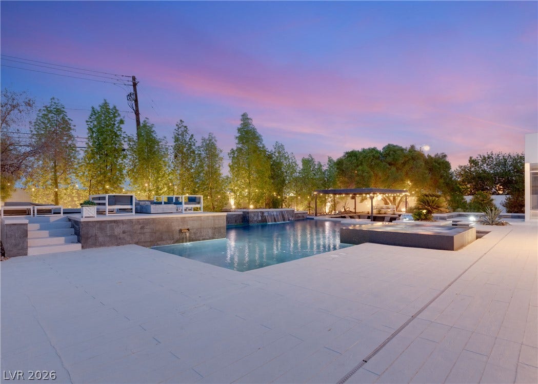 3716 Caesars Circle, Las Vegas, NV 89120 A spacious stone patio surrounds this sparkling swimming pool and integrated spa.