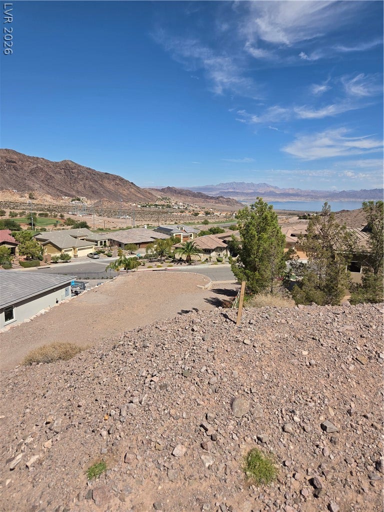 892 Jasper Way, Boulder City, NV 89005 Rugged hillside elevations overlook a quiet neighborhood cul-de-sac and distant mountain horizons.