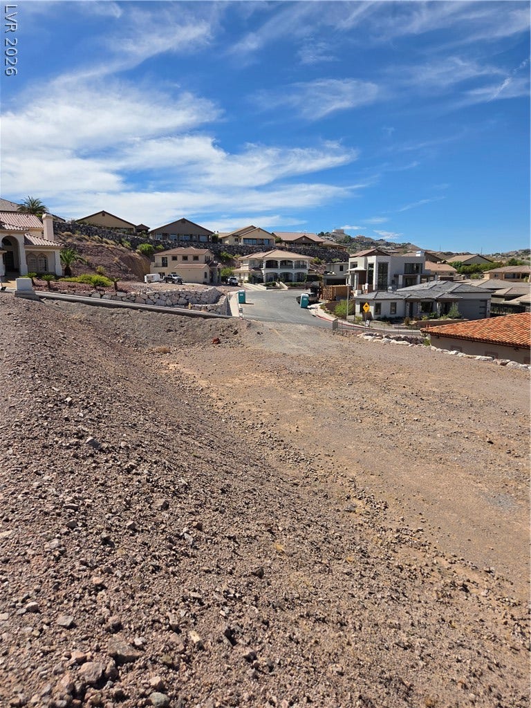 892 Jasper Way, Boulder City, NV 89005 An elevated buildable lot offers scenic views of the surrounding neighborhood and desert hillside.