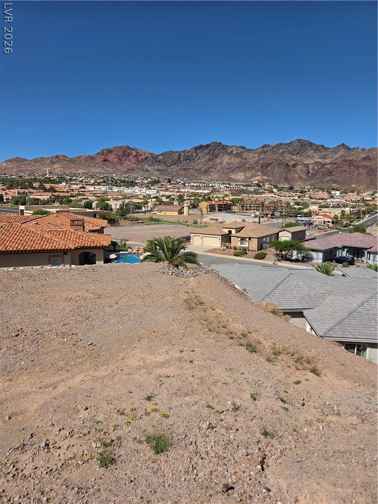 892 Jasper Way, Boulder City, NV 89005 Dramatic mountain vistas rise above the surrounding neighborhood from this elevated vantage point.