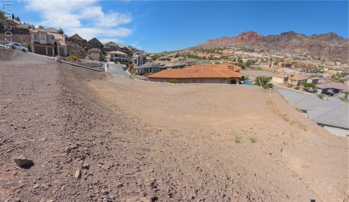 892 Jasper Way, Boulder City, NV 89005 Dramatic mountain vistas frame this elevated lot, offering prime potential for building a custom home.