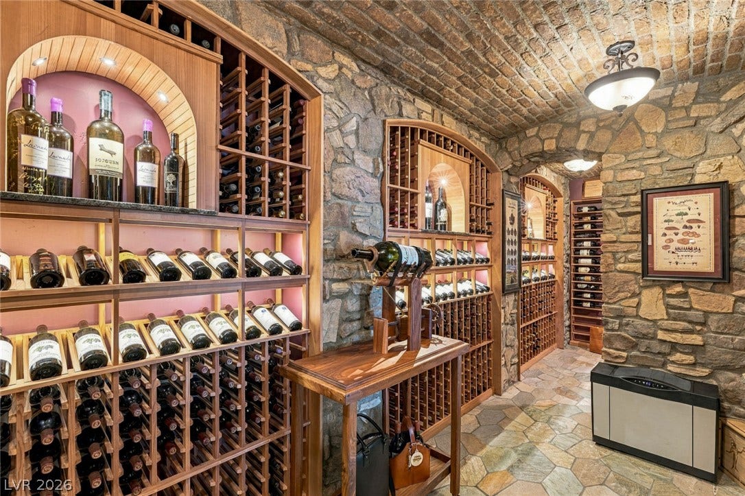 7 Lido Nord, Henderson, NV 89011 A vaulted brick ceiling and rustic stone walls define this beautifully crafted wine cellar.