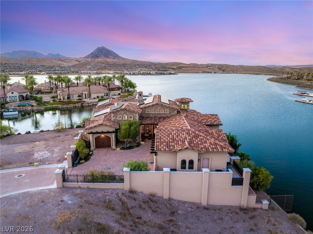 7 Lido Nord, Henderson, NV 89011 Dramatic mountain and water views surround this custom lakeside estate featuring Spanish tile roofing.