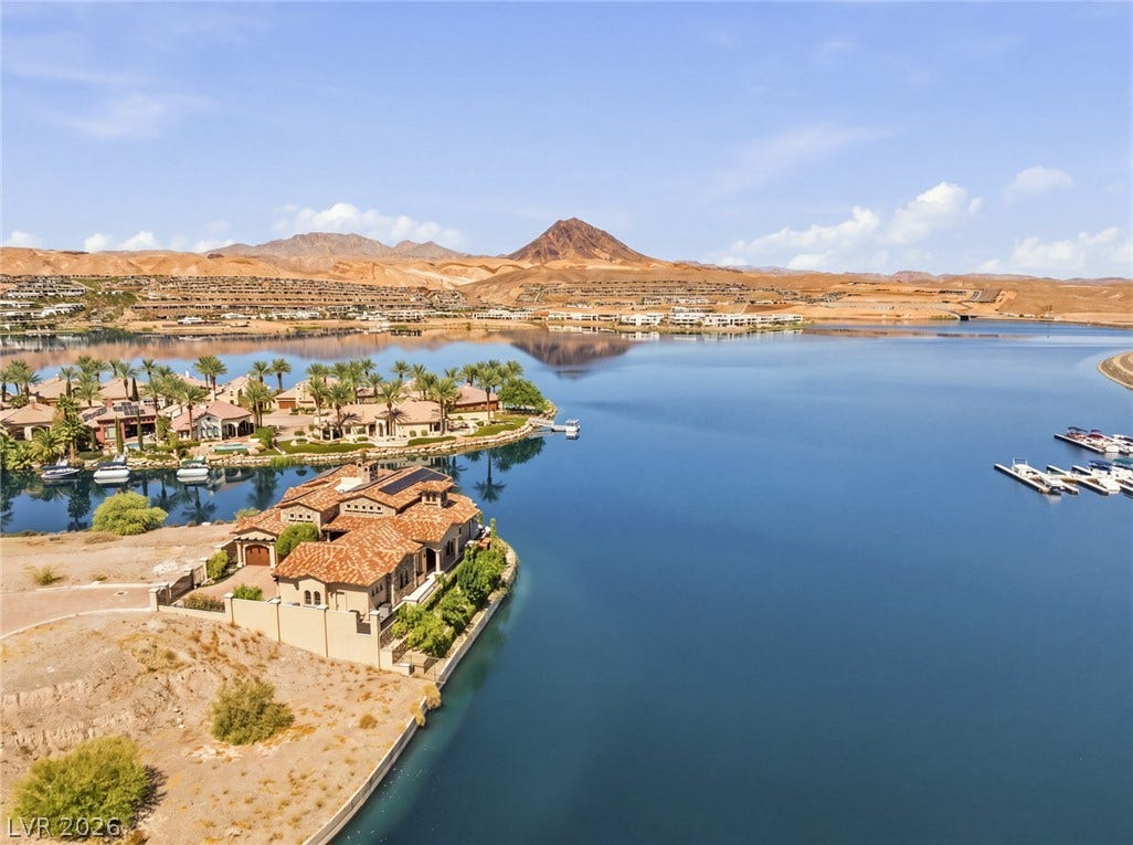 7 Lido Nord, Henderson, NV 89011 A magnificent waterfront home stands prominently along the tranquil shoreline of Lake Las Vegas.
