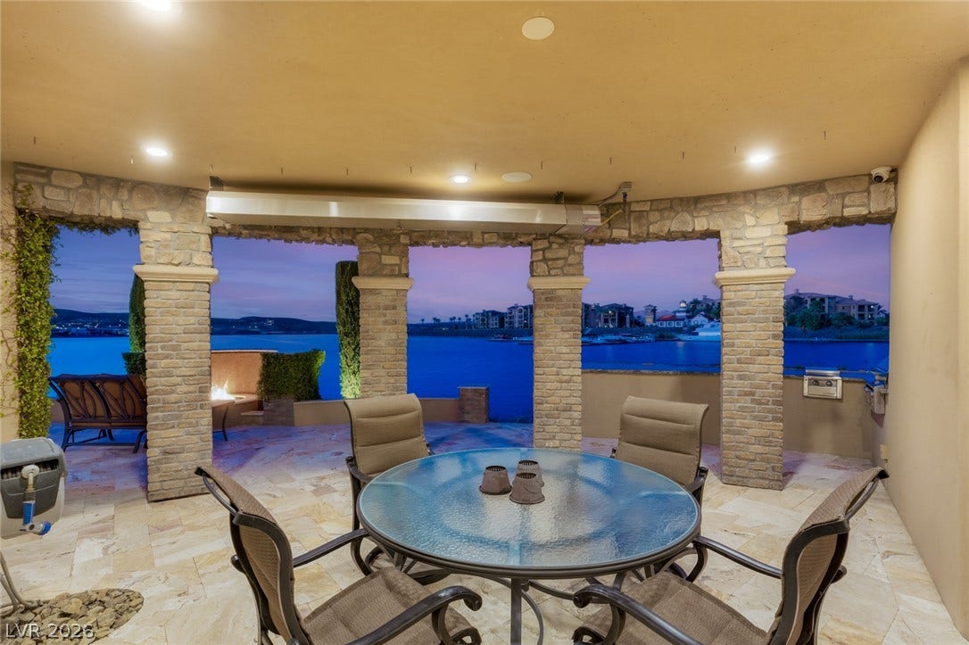 7 Lido Nord, Henderson, NV 89011 Stone pillars frame panoramic water views from this sheltered tile patio.