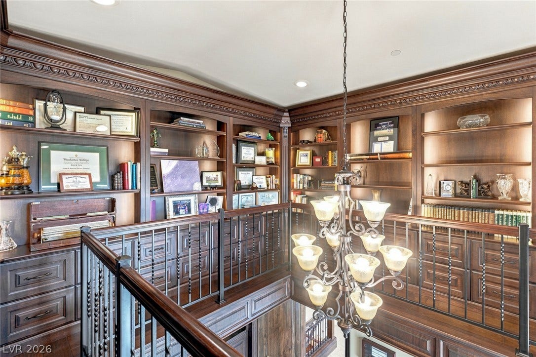 7 Lido Nord, Henderson, NV 89011 Richly detailed wooden built-ins and ornate crown molding frame this elegant upper-level landing.