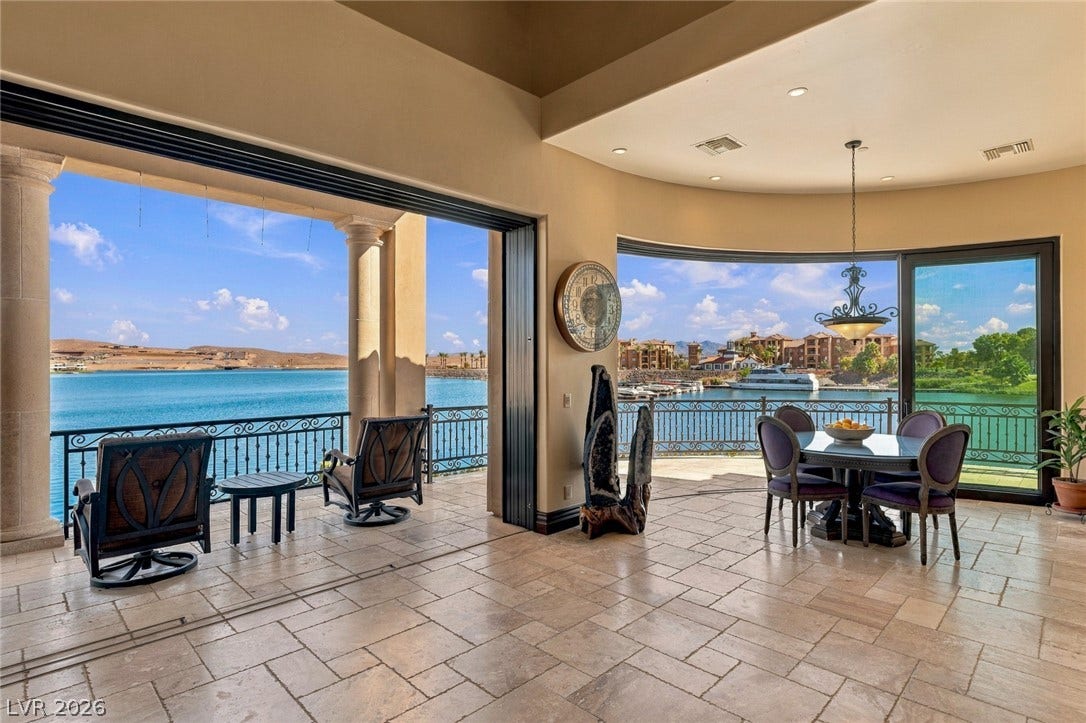 7 Lido Nord, Henderson, NV 89011 Massive sliding glass walls merge the tiled interior with panoramic open-water views.