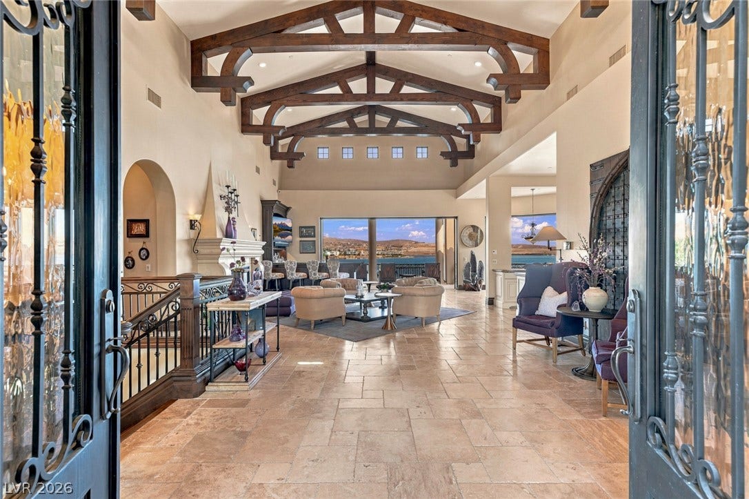 7 Lido Nord, Henderson, NV 89011 Dramatic exposed ceiling trusses frame the entry view into this expansive open-plan interior.