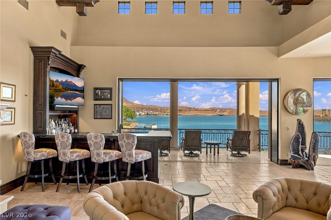 7 Lido Nord, Henderson, NV 89011 Soaring beamed ceilings crown this airy living space opening completely to expansive water views.
