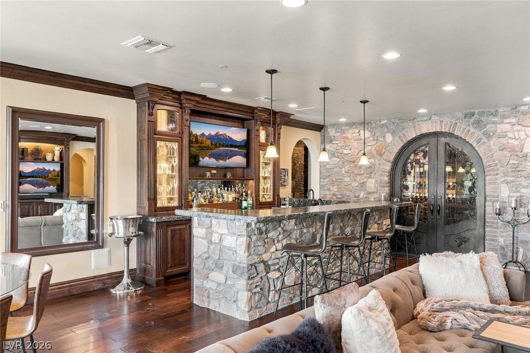 7 Lido Nord, Henderson, NV 89011 Rich wood details and stone finishes create an inviting space for home entertaining.