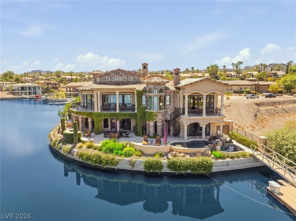 7 Lido Nord, Henderson, NV 89011 An exquisite waterfront estate captures the essence of luxury living with panoramic lake views.